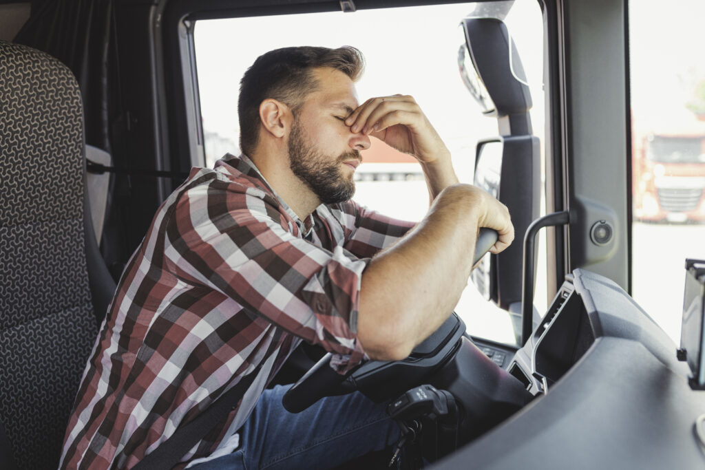 Portrait of Tired Truck Driver Feeling Sleepy and Sick